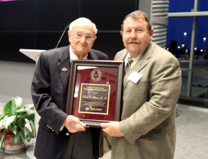Joe Paschal, Ph.D., right, presents the Animal Science Outstanding Alumni Award to Frank C. Litterst '43.