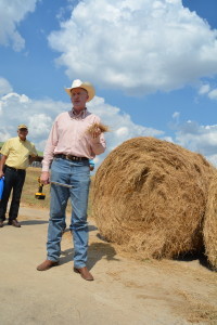 Dr. Rick Machen, Texas A&M AgriLife Extension Service livestock specialist, Uvalde, discusses how to use hay sampling with a probe to determine crude protein percentages. (Texas A&M AgriLife Extension Service photo by Blair Fannin)