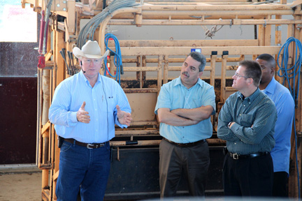 Dr. Ron Gill, associate head for Extension, left, discusses Beef Quality Assurance production practices used on ranches and farms to ensure beef supplied to stores is safe and wholesome.