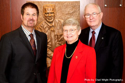 Artist Scott Myers, Kay Hesby and Dr. Russell Cross at the unveiling of the relief sculpture.
