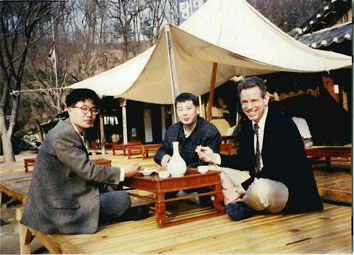 Smith, right, Chan Bun Choi and associate dine at the Suwon Korean Village prior to a tour of Korea.