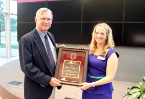 Jim Sanders, Ph.D., presents the Animal Science Outstanding Young Alumni Award to Rachel Cutrer '01.