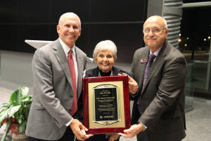 Jeff Savell, Ph.D., right, presents a plaque to Billy Rosenthal and Roz Rosenthal in recognition of E.M. "Manny" Rosenthal's posthumous induction into the Animal Science Hall of Fame.
