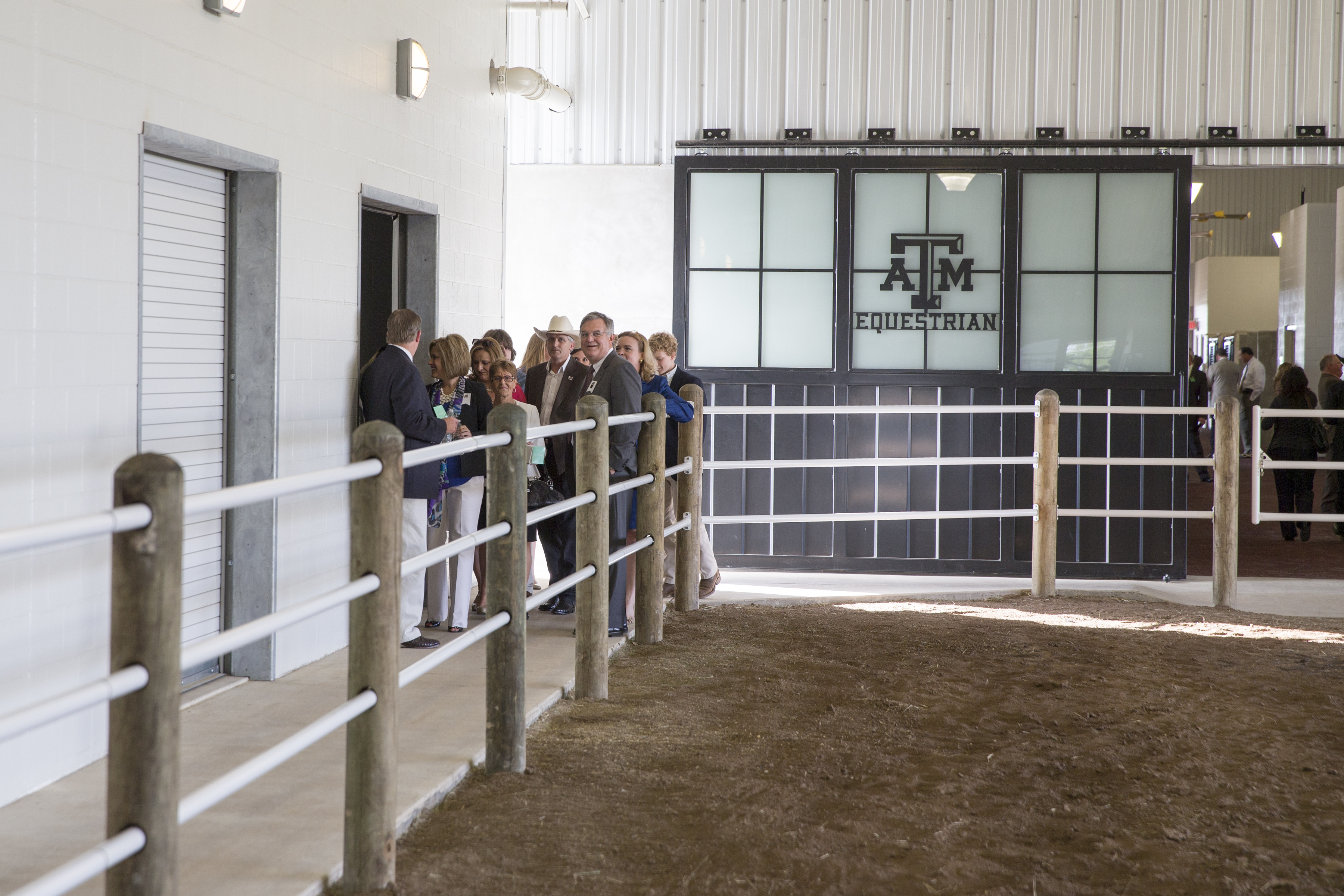People touring equine center