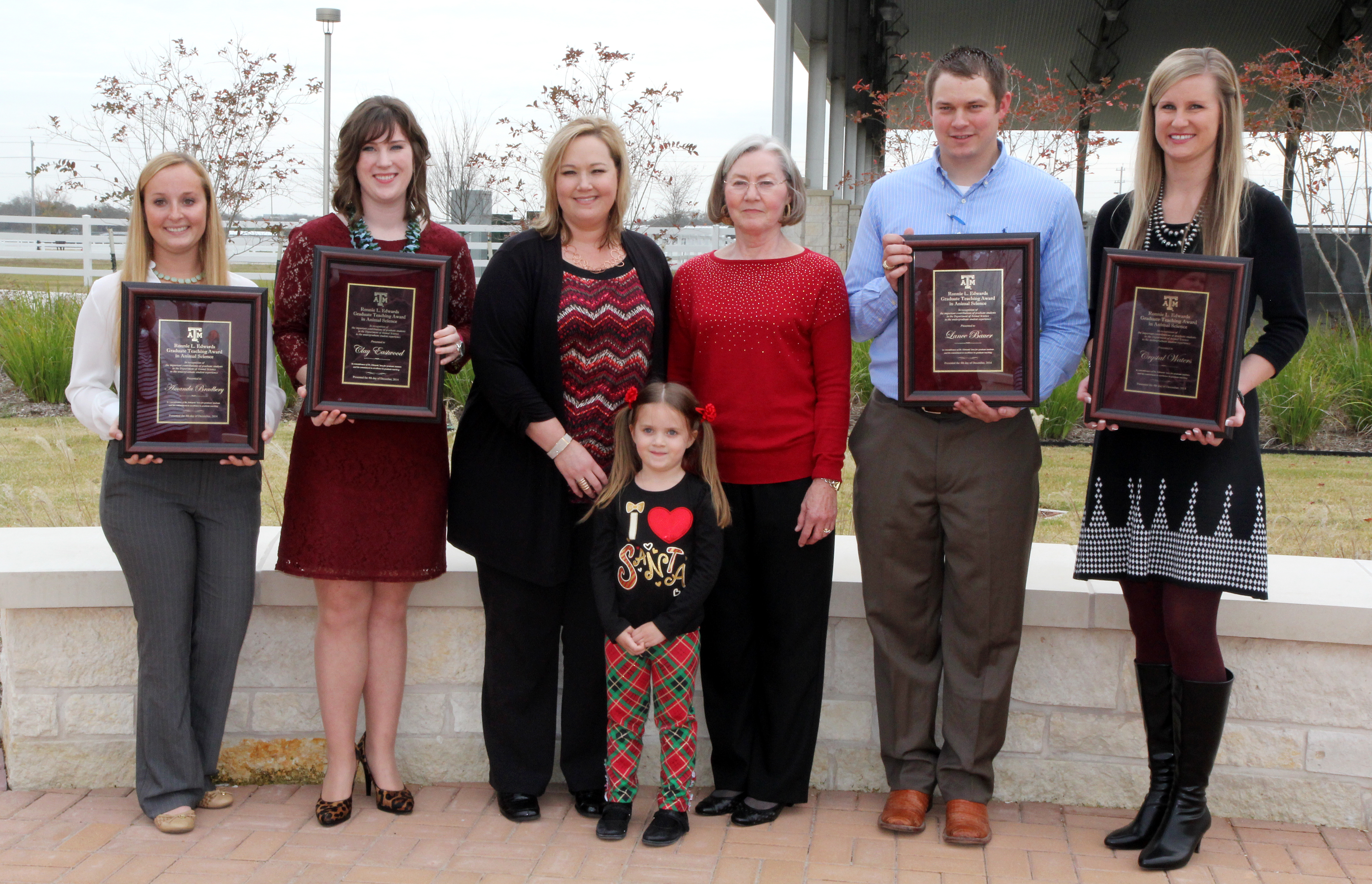 Group photo of Edwards family and award winners.
