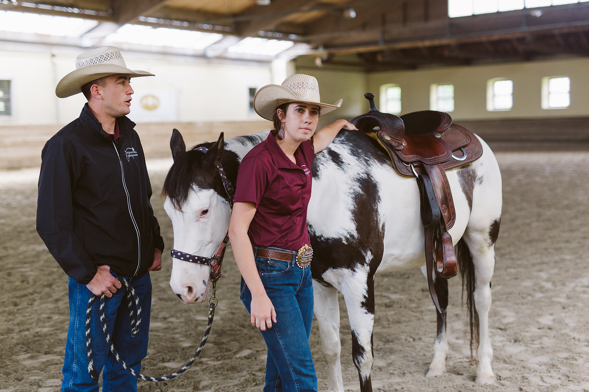 International Horsemanship School instructors pose with horse.