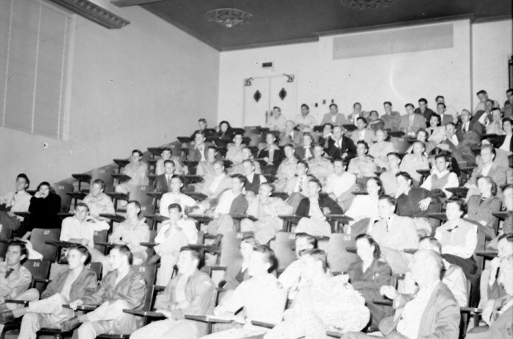 This 1949 view of the lecture hall shows the original stenciled ceiling that was subsequently painted over and hidden behind a suspended ceiling.  Our renovation efforts will bring back the multi-colored stenciling for modern students to admire.