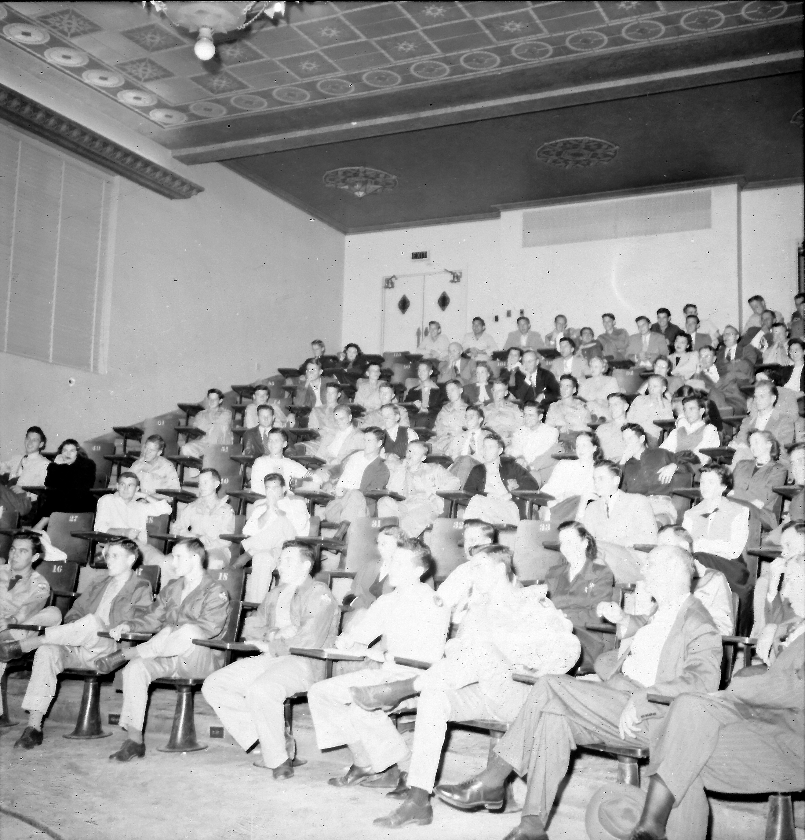 This 1949 view of the lecture hall shows the original stenciled ceiling that was subsequently painted over and hidden behind a suspended ceiling.  Our renovation efforts will bring back the multi-colored stenciling for modern students to admire.