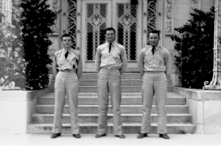 W. H. Crump, G Boesch and J. W. Autry standing in front of the Agricultural Engineering Building in 1942. They received honor awards from the ASAE Student Branch for their activities and leadership.