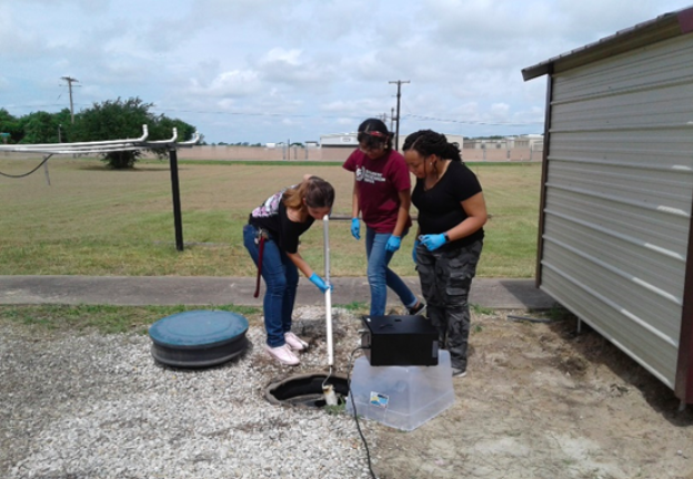 Graduate Students Collecting Samples on Rellis Campus.