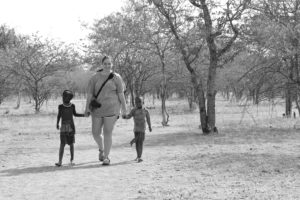 Being lead hand and hand by two Himba boys to the rest of the village.  Photo credit: Hannah Boyer