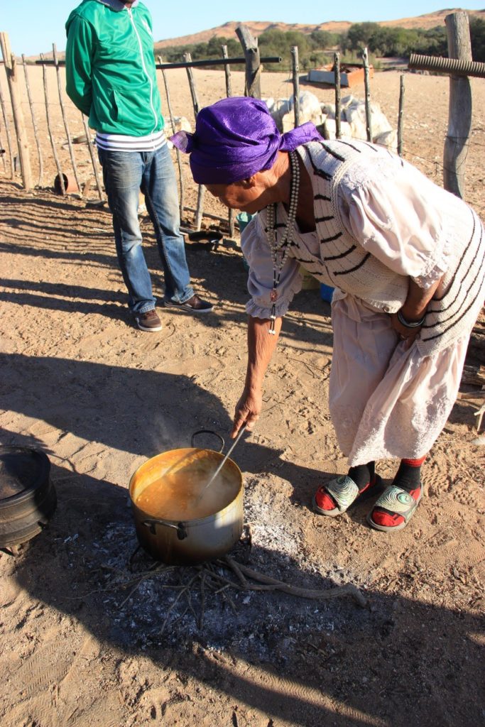 An elder of the Topnaar cooks !nara, a cultural staple, for her community.