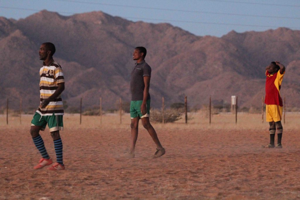 A small group of young adults playing football in Solitaire on July 16, 2017. Soccer is a major sport for Namibians, which helps to bring people together. 