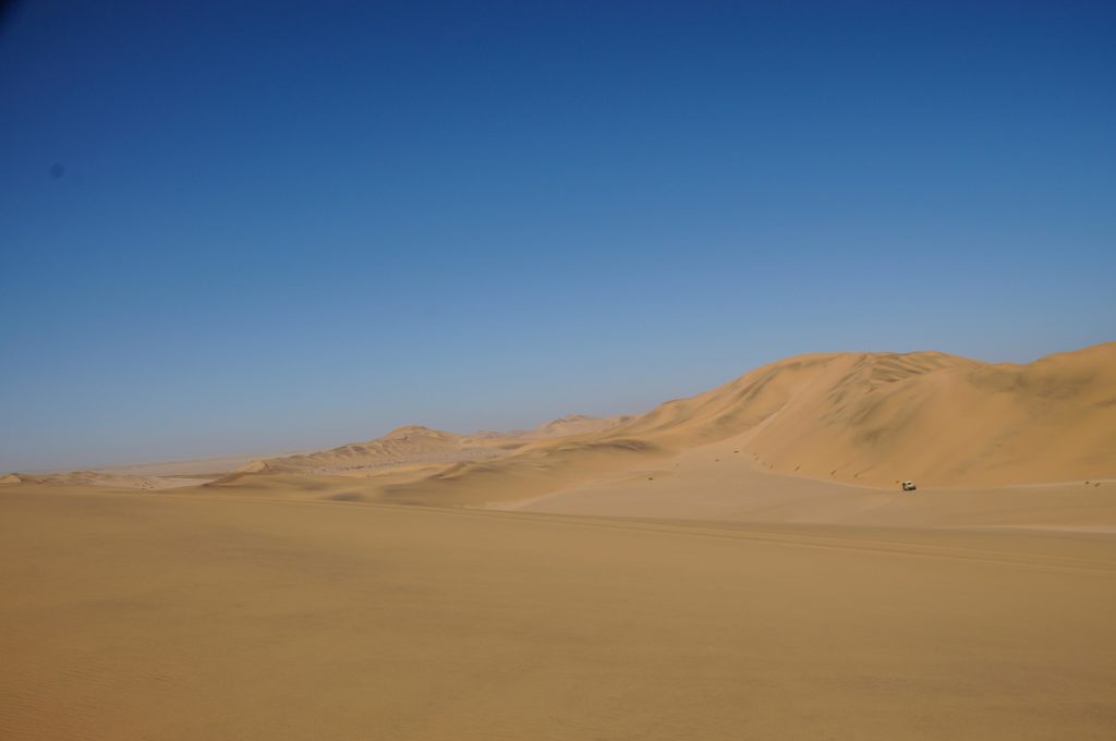 Sand dunes stretch across the Namib Desert. An excess number of vehicles can mar the desert’s beauty.