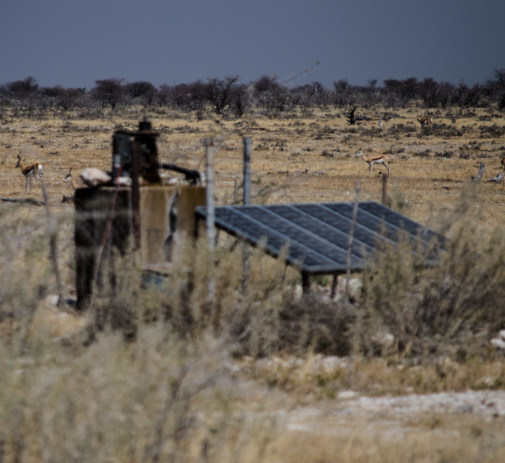 A solar panel collects sunlight in Etosha National Park. The rays collected by the solar panel turn into energy to pump water to an artificial watering hole.