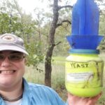 Agrilife Extension employee selfie with wasp collecting research equipment