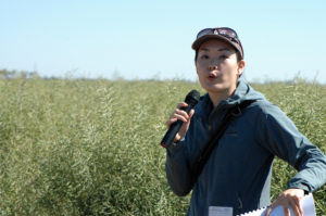 Dr. Emi Kimura discusses the fertilizer needs of canola at the Texas A&M AgriLife Research Chillicothe Station. (Texas A&M AgriLife Communications photo by Kay Ledbetter)