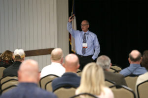 Dr. Peter Dotray talking to conference participants