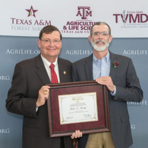 Dr. Kirk Jessup and Dr. Mark Hussey pose with award