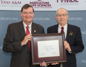 Dr. Wayne Smith and Dr. Mark Hussey pose with award