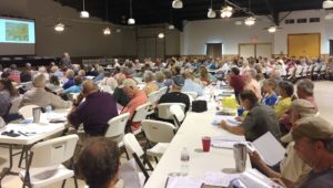 large room filled with about 100 participants