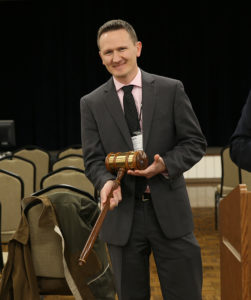 Dr. Clark Neely holding gavel