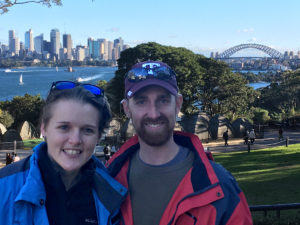 two people in park with Sydney, Australia, skyline in background