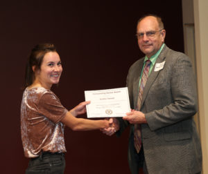 student receiving award from department head
